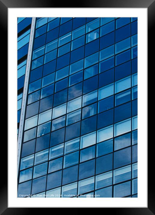 Modern glass building facade reflecting blue sky with clouds, architectural details and textures, urban background in Leeds, UK. Framed Mounted Print by Man And Life