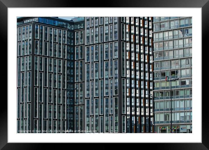 Modern glass office buildings with a pattern of windows reflecting the sky, showcasing urban architecture in Liverpool, UK. Framed Mounted Print by Man And Life