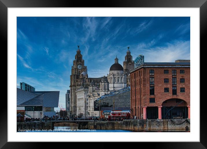 Liverpool waterfront with historic buildings and blue sky Framed Mounted Print by Man And Life