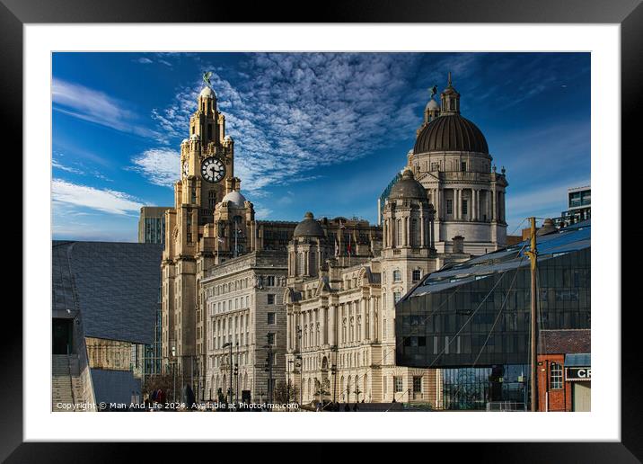 Liverpool's iconic waterfront buildings under a blue sky with wispy clouds. Framed Mounted Print by Man And Life