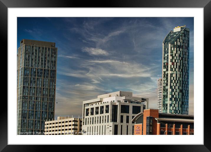 Modern cityscape with skyscrapers against a blue sky with wispy clouds in Liverpool, UK. Framed Mounted Print by Man And Life