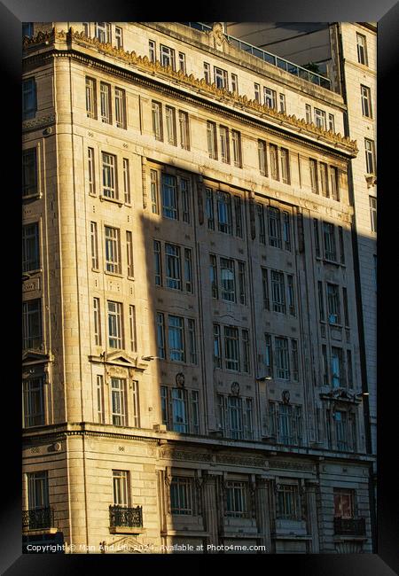 Sunlight casting shadows on a classic urban building facade during golden hour, highlighting architectural details in Liverpool, UK. Framed Print by Man And Life