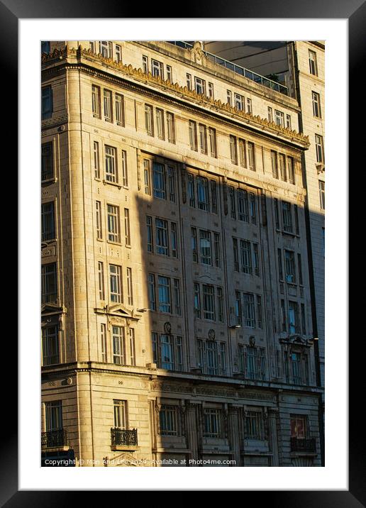 Sunlight casting shadows on a classic urban building facade during golden hour, highlighting architectural details in Liverpool, UK. Framed Mounted Print by Man And Life