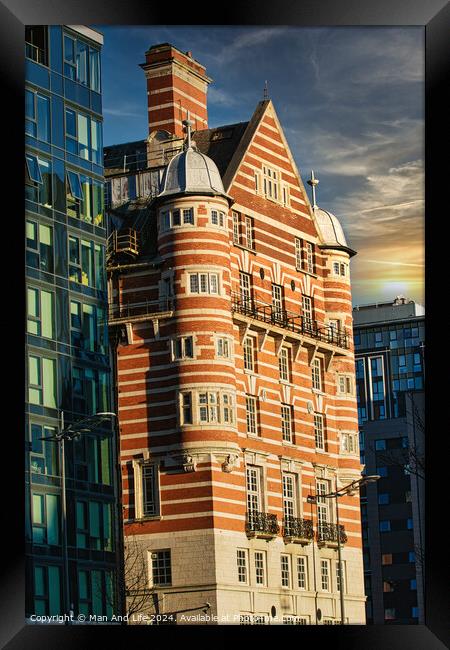 Traditional red brick building juxtaposed with modern glass facade architecture at sunset in Liverpool, UK. Framed Print by Man And Life