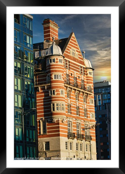 Traditional red brick building juxtaposed with modern glass facade architecture at sunset in Liverpool, UK. Framed Mounted Print by Man And Life