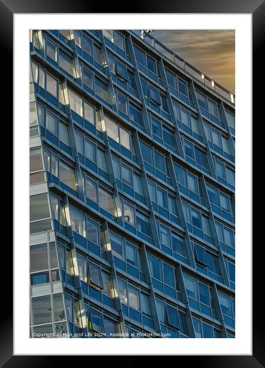 Modern office building facade with reflective glass windows against a twilight sky in Liverpool, UK. Framed Mounted Print by Man And Life