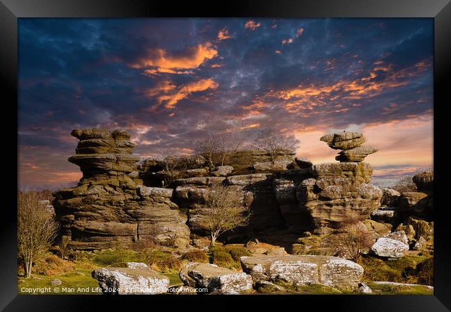 Dramatic sky at sunset over rugged rock formations in a serene landscape at Brimham Rocks, in North Yorkshire Framed Print by Man And Life
