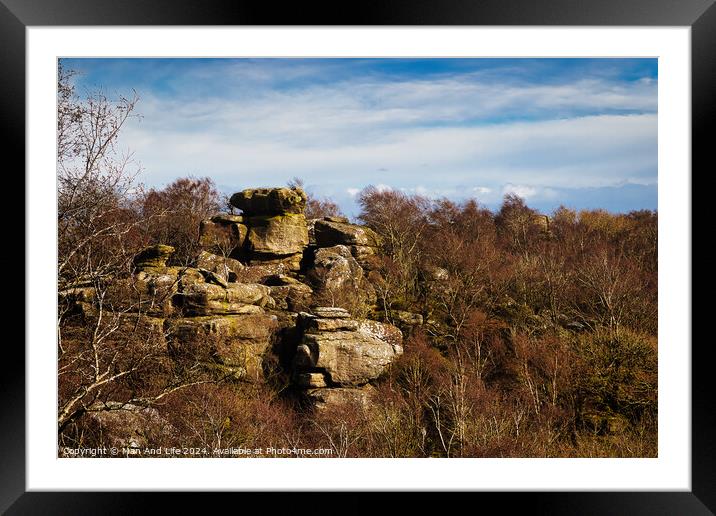 Rocky landscape with boulders and sparse vegetation under a cloudy sky at Brimham Rocks, in North Yorkshire Framed Mounted Print by Man And Life
