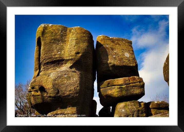 Majestic rock formations against a blue sky with clouds, showcasing natural erosion and geological textures at Brimham Rocks, in North Yorkshire Framed Mounted Print by Man And Life