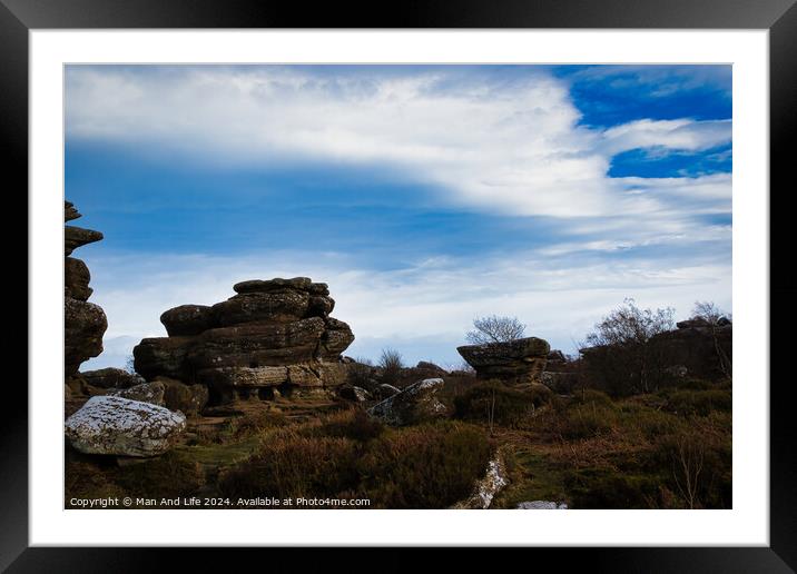 Scenic view of rugged rock formations amidst wild heath under a cloudy sky at Brimham Rocks, in North Yorkshire Framed Mounted Print by Man And Life