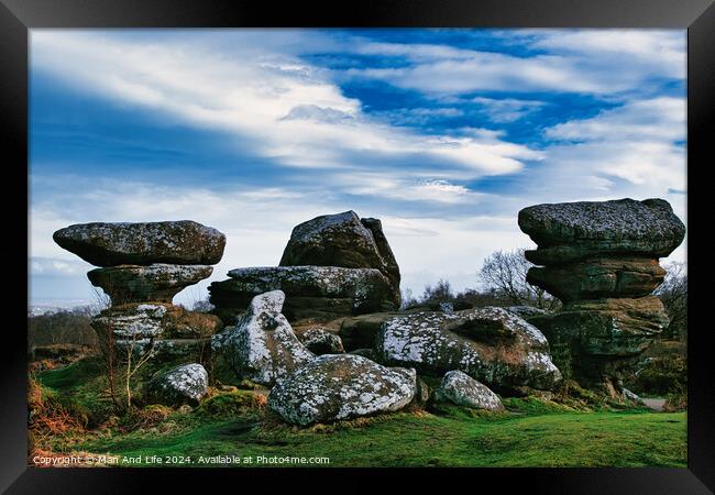 Scenic view of unique rock formations under a blue sky with clouds at Brimham Rocks, in North Yorkshire Framed Print by Man And Life