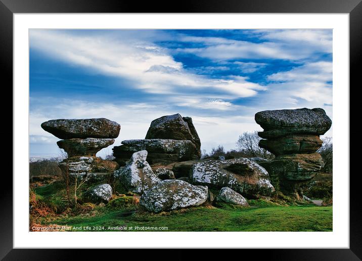 Scenic view of unique rock formations under a blue sky with clouds at Brimham Rocks, in North Yorkshire Framed Mounted Print by Man And Life