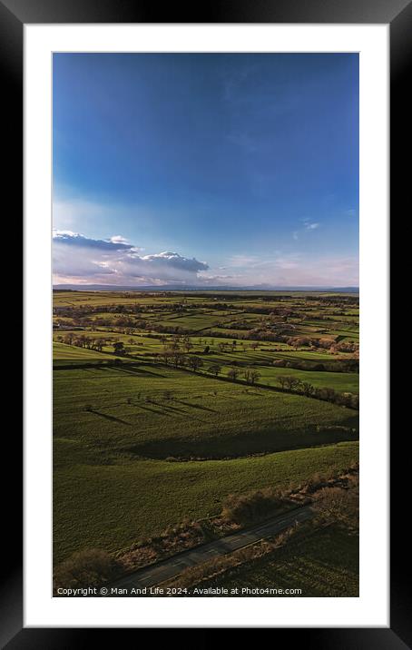 Scenic aerial view of lush green fields under a dramatic sky at dusk, showcasing the beauty of rural landscapes in North Yorkshire. Framed Mounted Print by Man And Life