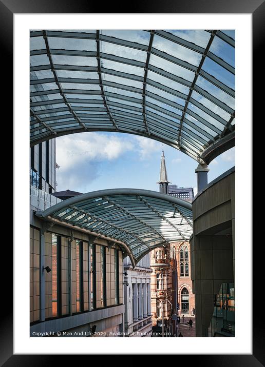 Modern glass canopy over a pedestrian walkway with historic architecture in the background on a sunny day in Leeds, UK. Framed Mounted Print by Man And Life