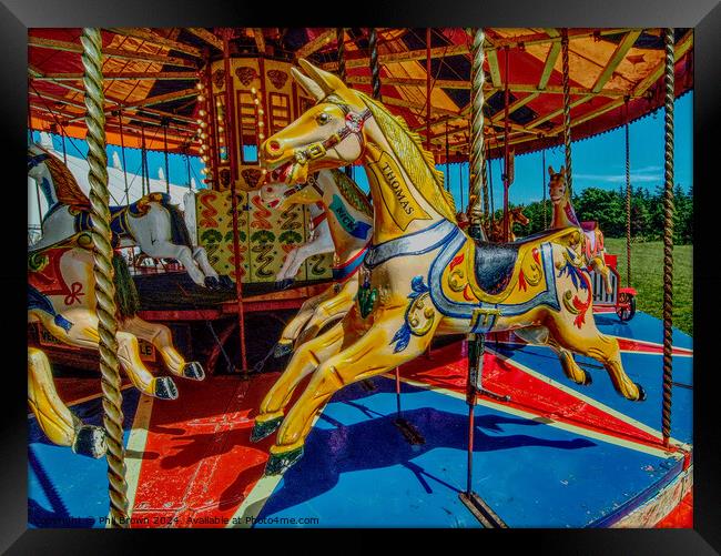 Gallopers on a carousel ride. Framed Print by Phil Brown