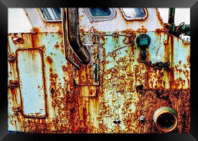 very rusty trawler in Maryport harbour. Framed Print by Phil Brown