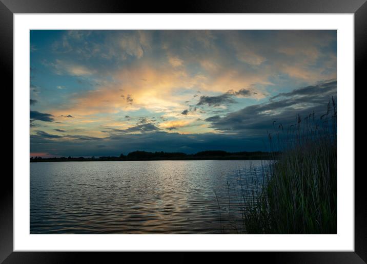 Clouds after sunset over the lake with reeds Framed Mounted Print by Dariusz Banaszuk
