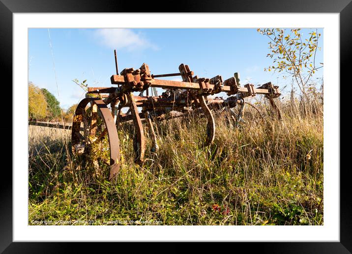 Farming Machine Left Behind Framed Mounted Print by Dean Jeffery