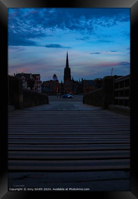 Sunset over city Framed Print by Amy Smith