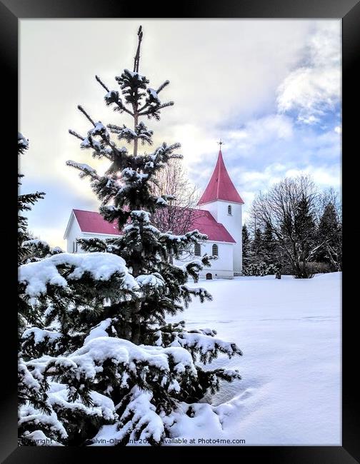 Iceland church and trees in snow  Framed Print by Robert Galvin-Oliphant