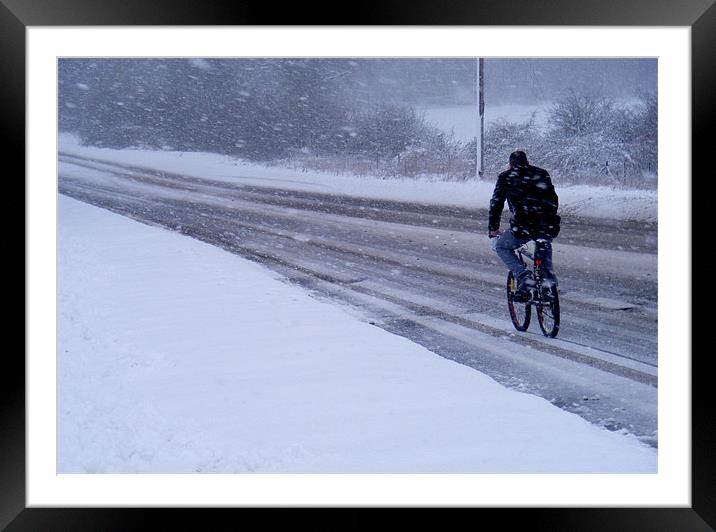 Cyclist In The Snow Framed Mounted Print by val butcher