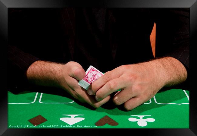 gambler shuffles the cards Framed Print by PhotoStock Israel