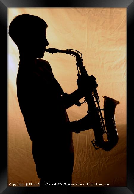 Saxophone player Framed Print by PhotoStock Israel