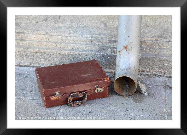 Old cardboard suitcase in the street Framed Mounted Print by PhotoStock Israel