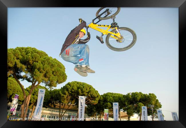 Extreme Bicycle sport jump Framed Print by PhotoStock Israel