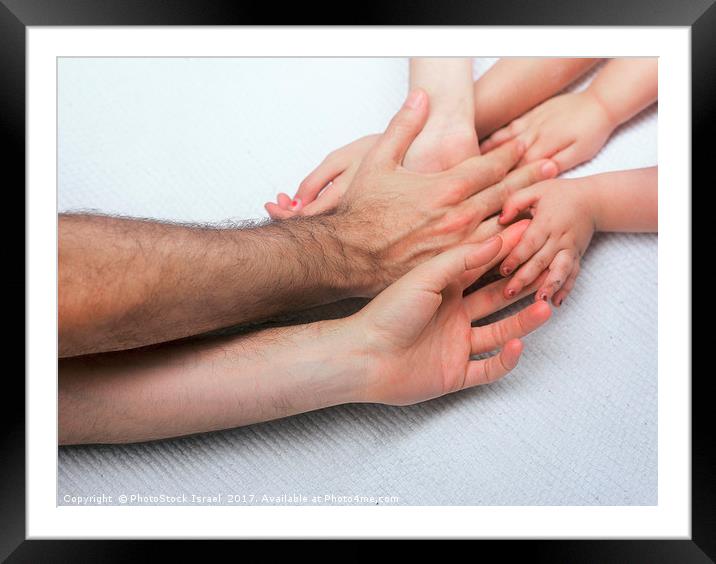 entangled Family hands Framed Mounted Print by PhotoStock Israel