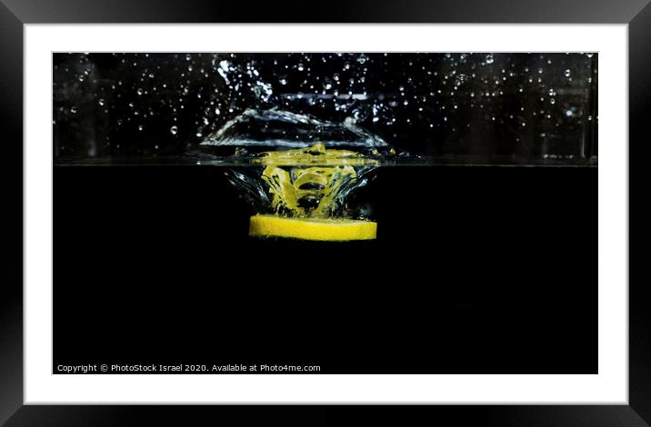 Lemon dropped into water  Framed Mounted Print by PhotoStock Israel