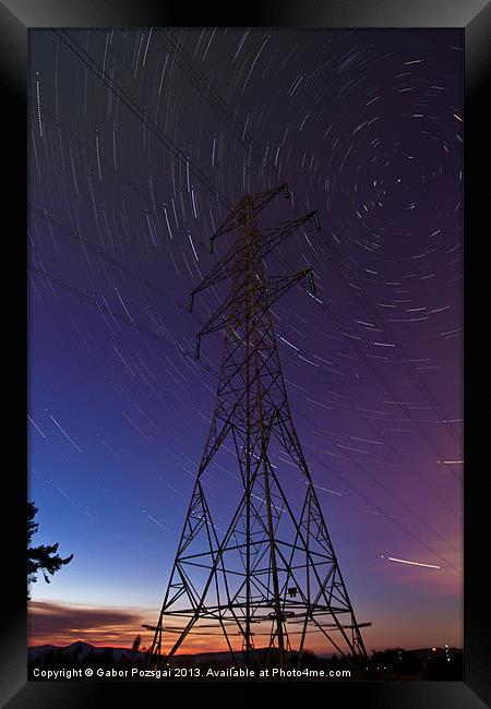 Power line and star trails Framed Print by Gabor Pozsgai
