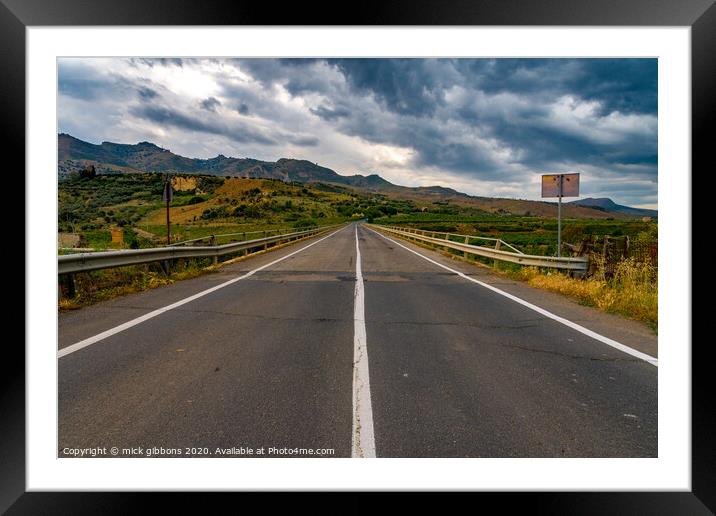 Long road to nowhere Framed Mounted Print by mick gibbons