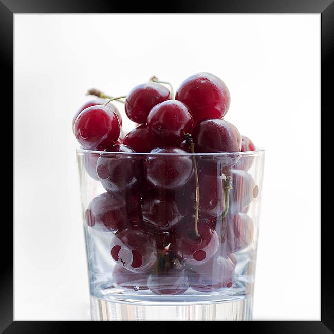 a glass with cherries Framed Print by Adrian Bud