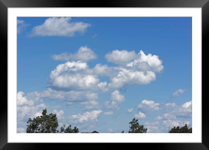 Blue sky with white clouds Framed Mounted Print by Adrian Bud