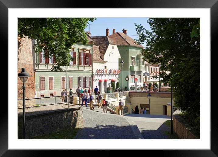 Tourists visiting Old Town Sibiu Romania Framed Mounted Print by Adrian Bud