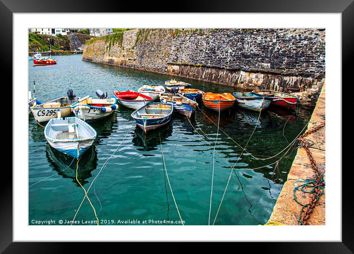 Rowing boats In Mevagissey Outer Harbour Framed Mounted Print by James Lavott