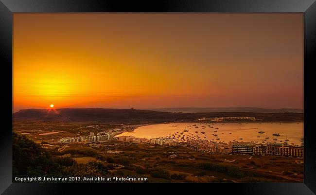 Sunset Over Mellieha Bay Framed Print by Jim kernan