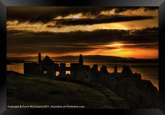 Sunset over Dunluce Castle Framed Print by David McFarland