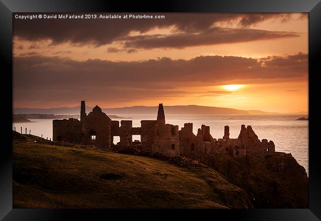Sunset over Dunluce Castle Framed Print by David McFarland