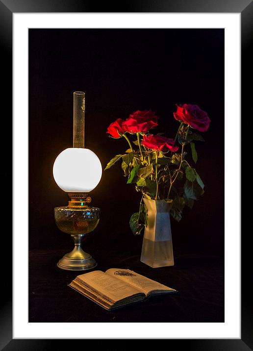 Reading by oil lamp Framed Mounted Print by Brian Roscorla