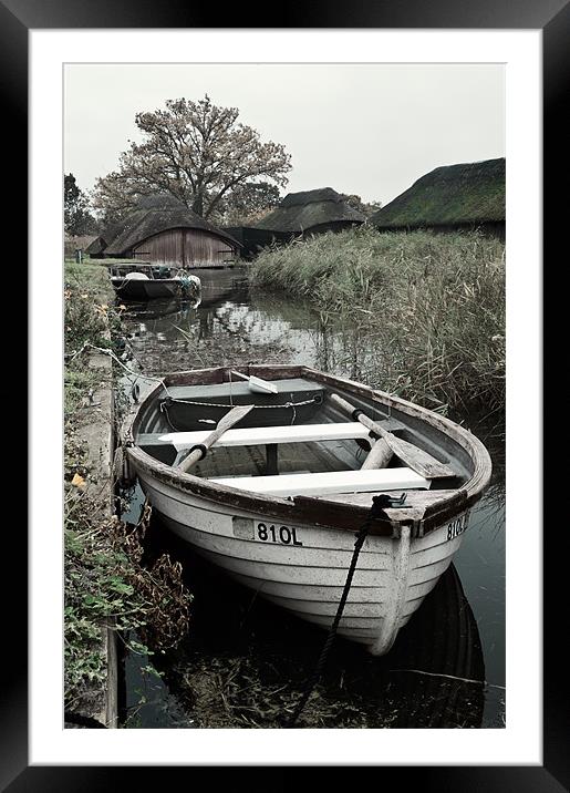 Moored rowing boat Framed Mounted Print by Stephen Mole