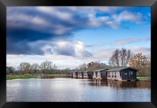 Wooden boathouses Framed Print by Stephen Mole