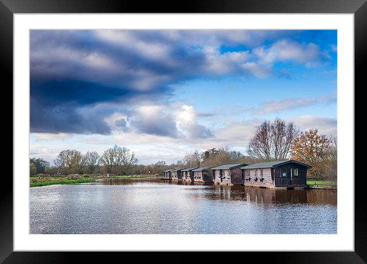 Wooden boathouses Framed Mounted Print by Stephen Mole