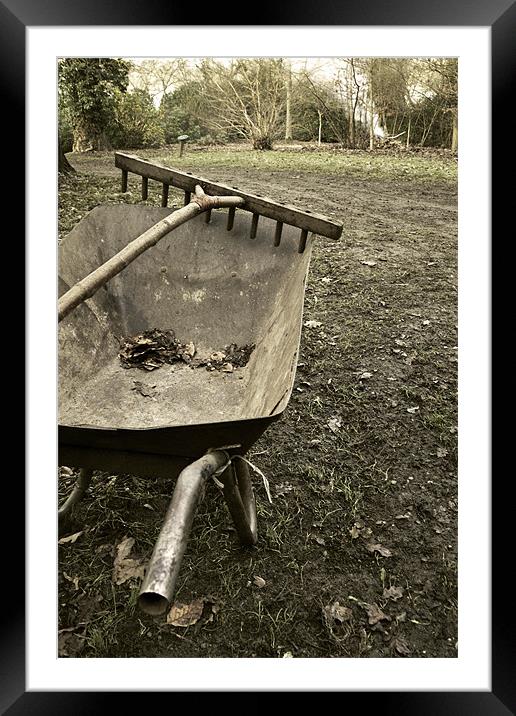 Wheelbarrow and wooden rake Framed Mounted Print by Stephen Mole