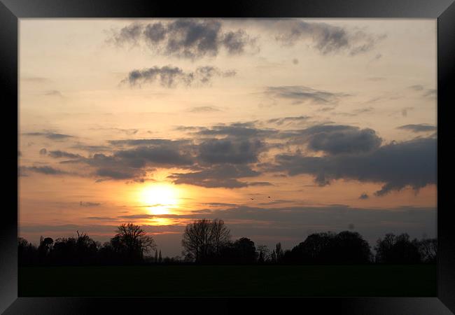 Sunset Over Greensands Framed Print by Rick Wilson