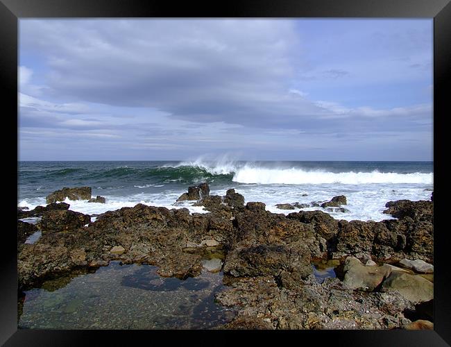Wave breaking in Lossiemouth Framed Print by Dave Wyllie