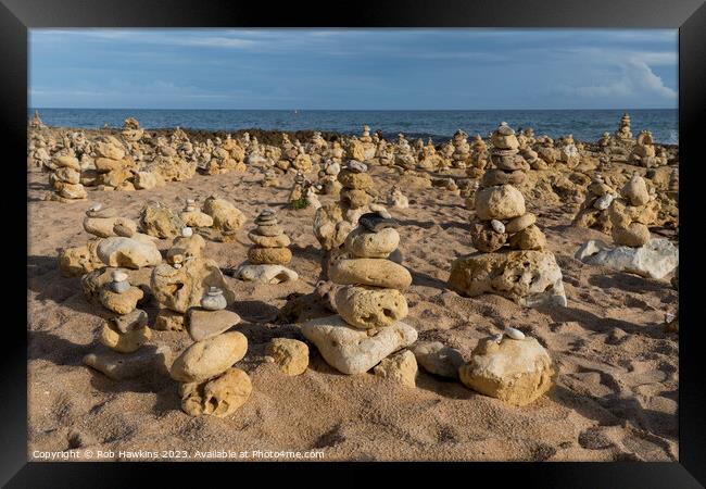 Oura beach stone stacks Framed Print by Rob Hawkins