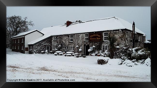 Thelbridge Cross in the snow Framed Print by Rob Hawkins