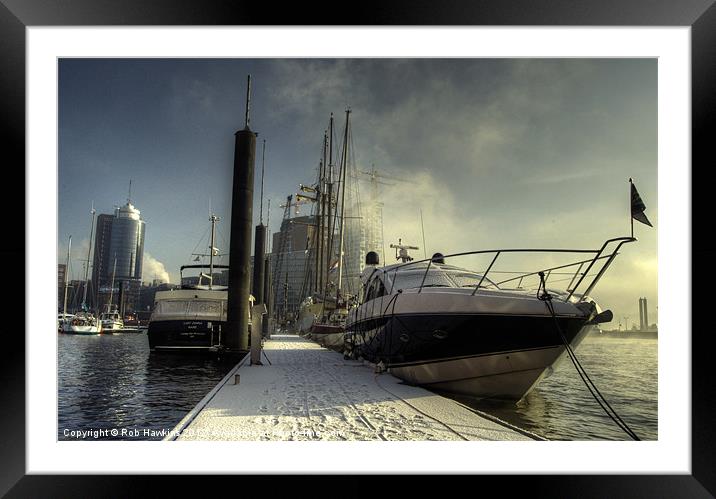 Yachts the city & snow Framed Mounted Print by Rob Hawkins